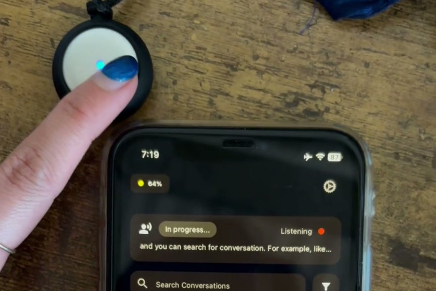Omi pendant next to the app on a desk