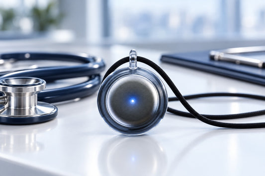 Omi pendant on a clinic desk next to a stethoscope
